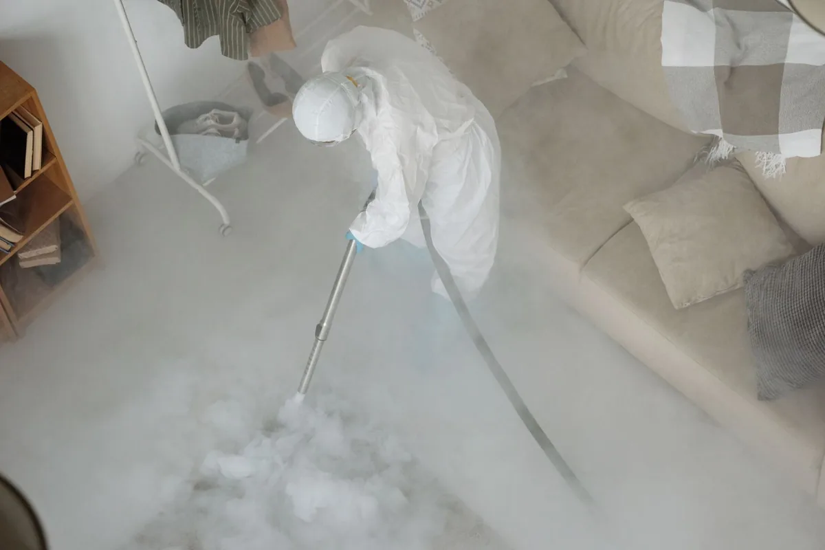 Biohazard cleanup technician in protective equipment, New Town, ND